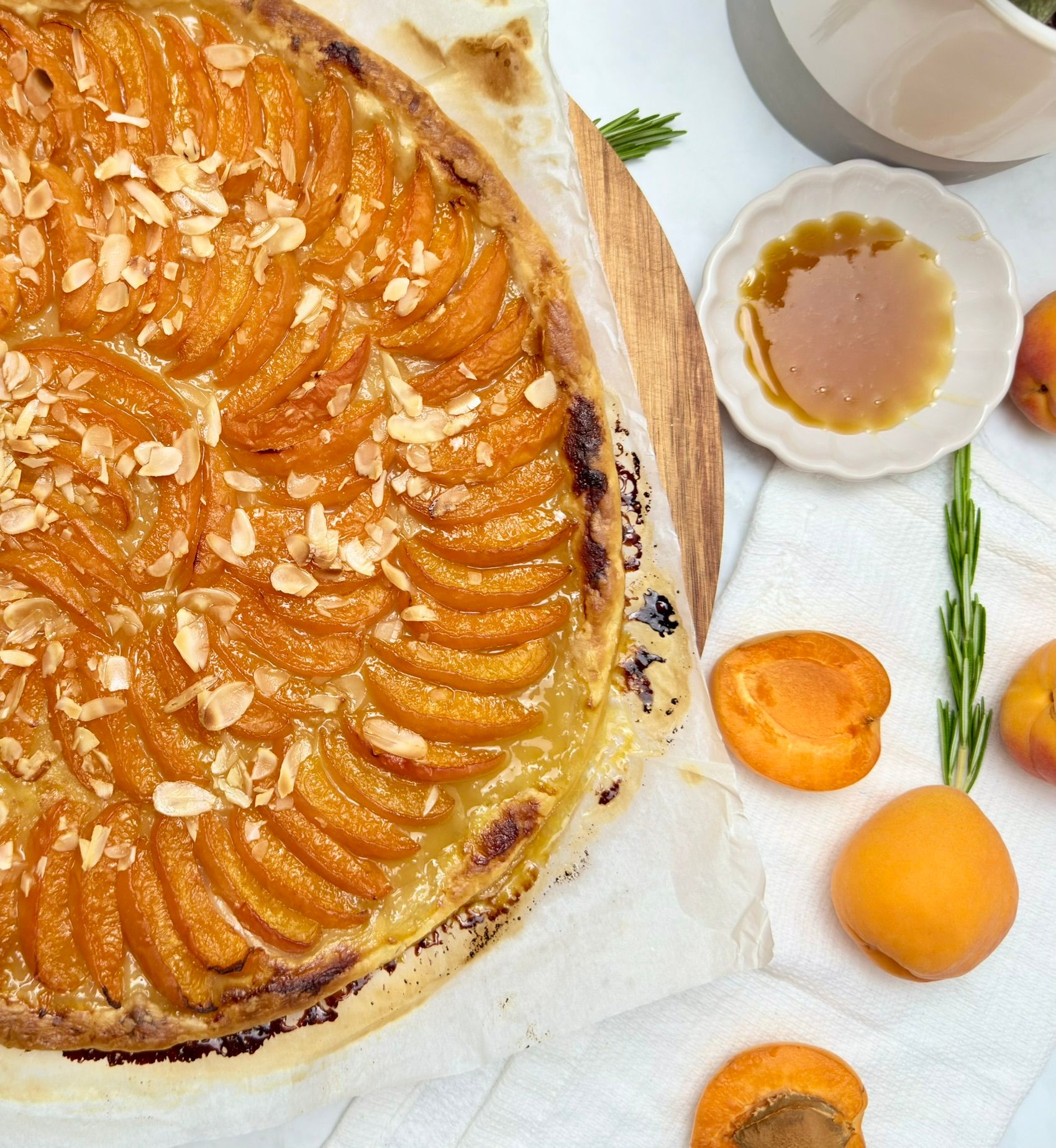 A golden, buttery Cyril Lignac galette des rois with a flaky, puffed-up crust and visible scoring.